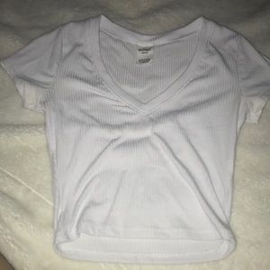 white croptop (shows cleavage)